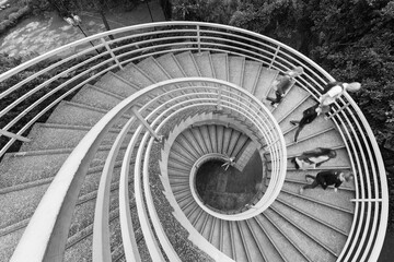 Pedestrian on spiral staircase