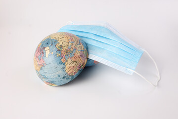 globe planet world map earth wearing face mask on white background