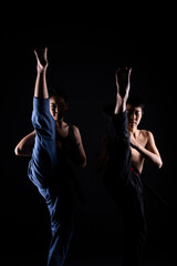 TaeKwonDo Karate teenager athlete kick punch black background isolated