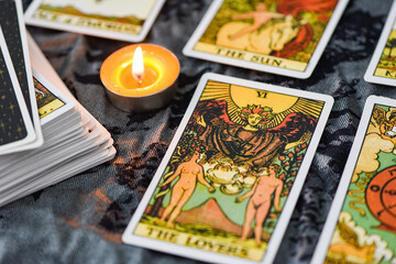 Tarot cards by candlelight on dark background fortune card prophecy, gypsy card for fortune teller...