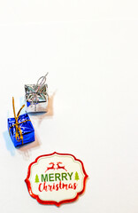 Christmas composition. Gifts, fir tree branches, red decorations on white background. Christmas, winter, new year concept. Flat lay, top view, copy space