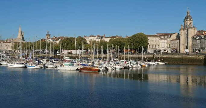 La Rochelle,Charente Maritime department, Region Nouvelle Aquitaine, France. View of the old harbour. On the right side is the Grosse Horloge tower, on the left side are the harbour towers.