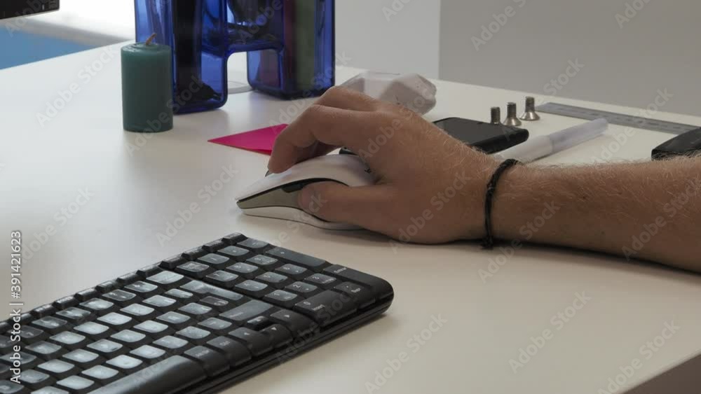 Poster man working with mouse in office