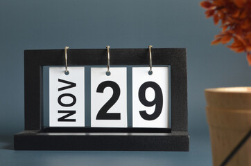 November 29, Date design with a black wooden calendar for a business, Date Plans to reminder.