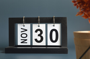 November 30, Date design with a black wooden calendar for a business, Date Plans to reminder.