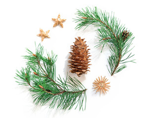 A natural pine branch and a big cone are on a white background and are decorated with straw decorations. Minimalistic New Year, Christmas concept. Flat lay. Top view.