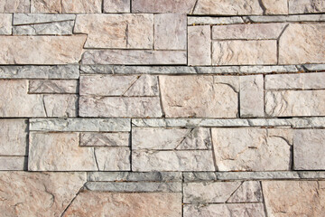 Multi-sized decorative marble block wall texture background.