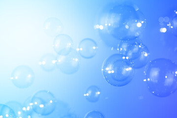 Blue soap bubbles float background. natural fresh, bubbly shiny clear texture background.