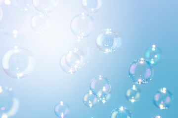 Beautiful shiny blue soap bubbles texture background. Abstract, Natural fresh soapy summer background.