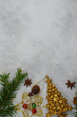 christmas holiday background with copy space, spruce or fir branch, golden decorations top view, flat lay, mock up, festive frame