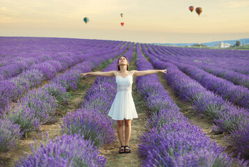 beautiful young woman on lavender field