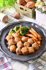 Chicken meatballs in creamy sauce on a plate  