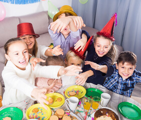 vigorous kids having good time during friend birthday party