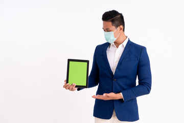 Portrait of a happy businessman. Showing copy space on the tablet with masks for health