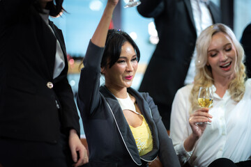 success and winning concept - happy business team celebrating victory in coworking space