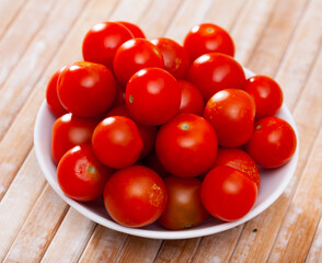 photo of heap cherry tomato on table