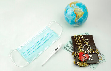 Fototapeta na wymiar Travel ban concept, Passport wrapped in a chain with a lock