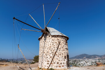 Fototapeta na wymiar Old windmill in sunny day, Bodrum, Turkey. 