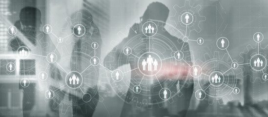 Obraz premium Teamwork. Gears on the background of a modern office building and people.