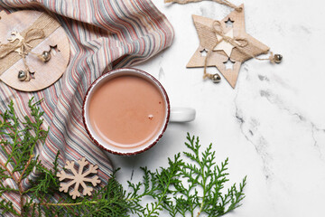 Obraz na płótnie Canvas Cup of hot cacao drink with Christmas decorations on white background