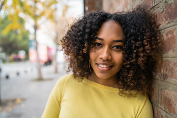 Portrait of Afro-american woman in the street.