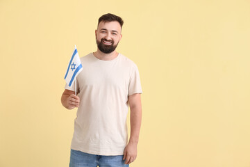 Man with the flag of Israel on color background