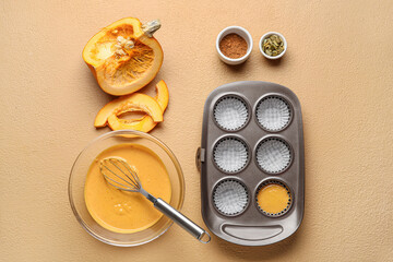 Preparing of tasty pumpkin muffins on table