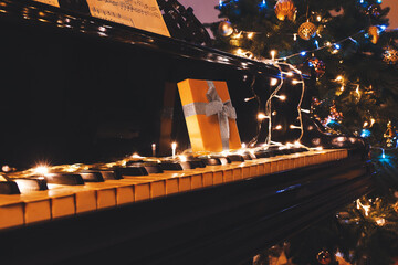 Grand piano with Christmas gift and decor, closeup © Pixel-Shot