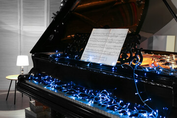 Grand piano decorated for Christmas in room