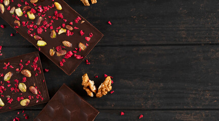 Homemade delicious dark bitter chocolate bars with raspberries pistachio and walnut.  Healthy diet...