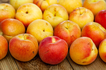 Naklejka na ściany i meble Group of fresh sweet apricot fruits on wooden table
