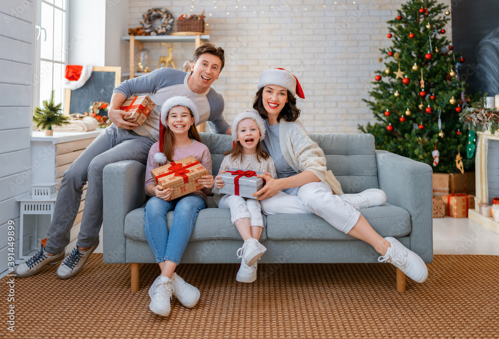 Wall mural family celebrating Christmas