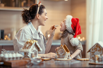 Family cooking gingerbread house