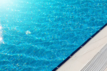 Sunny swimming pool in tropical resort