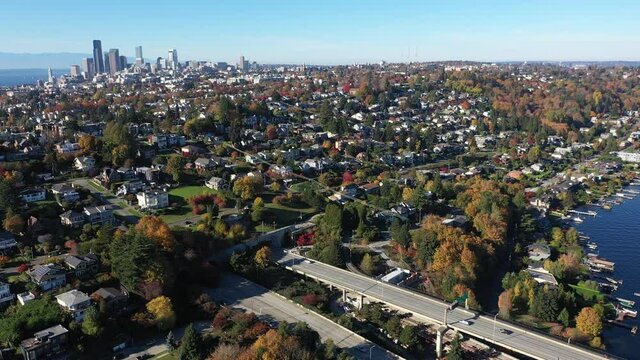 Aerial / drone footage of East side of Seattle, Atlantic, Judkins Park, Seattle downtown, Leschi, the I-90 bridge, Lake Washington and surrounding suburbs, in King County, Washington