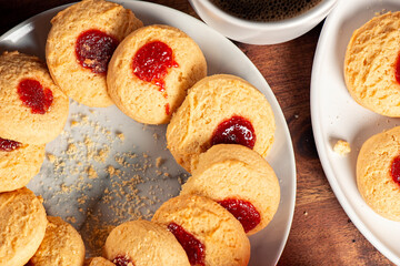Delicious fresh baked jam drop biscuits, food background.