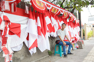 Fototapeta na wymiar portrait of a young man selling the Indonesian national flag