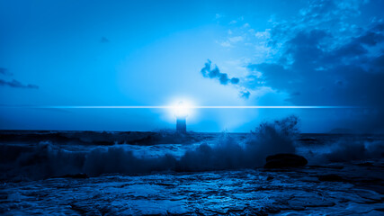Distant lighthouse in a stormy sea in night
