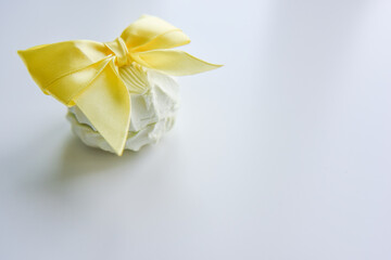 selective focus at the light green marshmallow with yellow ribbon