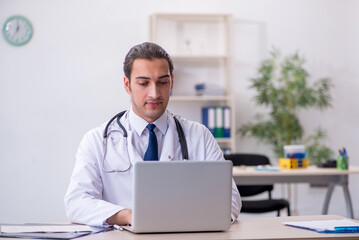 Young male doctor in telemedicine concept