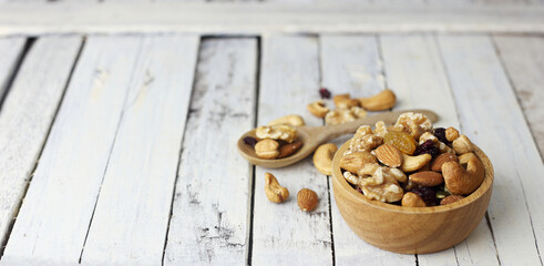 Fototapeta na wymiar Bowl of mixed nut for healthy life on wwoden table