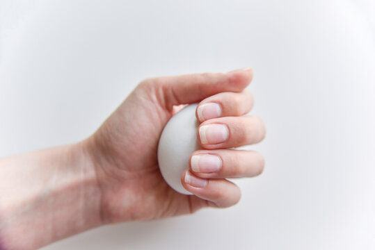 selective focus at the white egg in the hand