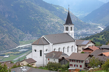 Fototapeta na wymiar Eisscholl, Switzerland on july 17, 2020: The restored church of the small village of Eisscholl, Switzerland