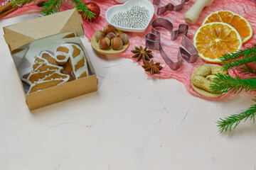 Fototapeta na wymiar Christmas background with cooking ingredients and ready-made glazed cookies. Copy of the space