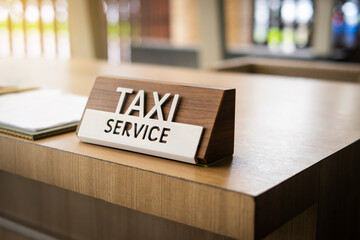Taxi service sign on a table