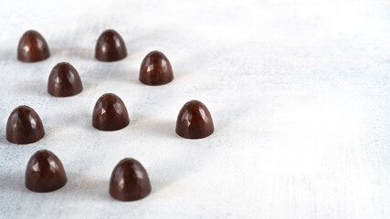 Natural chocolate tasty sweets with reflection on it. Selective focus. Copy space.