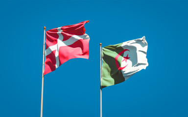 Beautiful national state flags of Denmark and Algeria together at the sky background. 3D artwork concept.