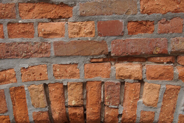 Fototapeta premium Antique red brickwork on the wall of the abbey