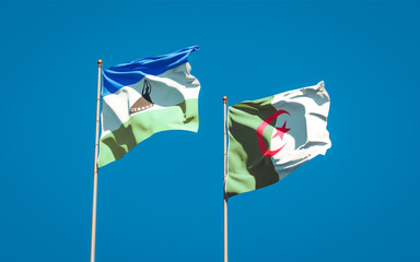 Beautiful national state flags of Lesotho and Algeria together at the sky background. 3D artwork concept.