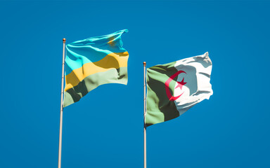 Beautiful national state flags of Rwanda and Algeria together at the sky background. 3D artwork concept.
